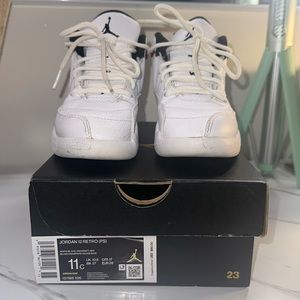 Pre owned kids Jordan 12 Retro sneakers, white, black and red in color.